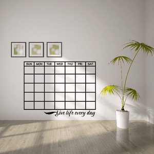 Monthly calendar wall decal with grid, day labels, and "Live life every day" slogan.