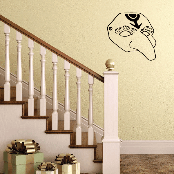 Long nose mask decal with outlined birdlike head in black on a light wall