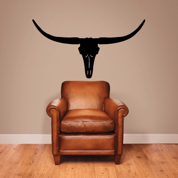 Longhorn skull wall decal, black vinyl silhouette above a chair
