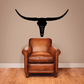 Longhorn skull wall decal, black vinyl silhouette above a chair