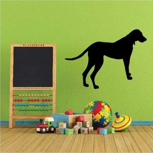 Black looking dog wall decal with long tail and legs, facing right