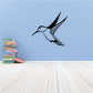 Hummingbird wall decal with blue body and black wings, outlined design