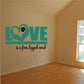 Teal LOVE wall decal with paw-heart and text: 'is a four legged word'.