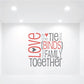 Family wall decal text: “Love is the Tie that Binds this Family Together” in red and gray