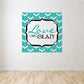 Teal wall decal with 'Love like Crazy' script in a white decorative frame