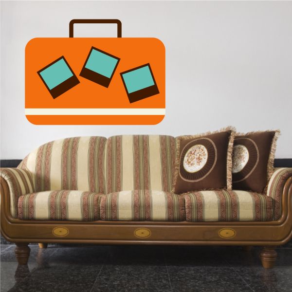 Orange suitcase wall decal with teal and black cube icons and small top handle