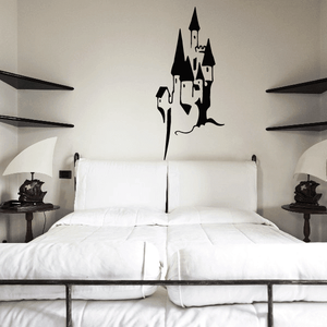 Black castle wall decal silhouette above bed