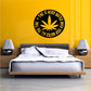 Round wall decal with cannabis leaf symbol and slogan, black with yellow center