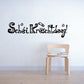 Christmas wall decal with “Schéi Krëschtdeeg!” lettering and small star accents