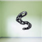 Metal chain sticker with interlocking dark links in an S-shaped curve