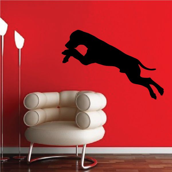 Black hound dog decal in mid-air silhouette