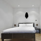 Christmas light decal with a single black bulb silhouette on a light wall