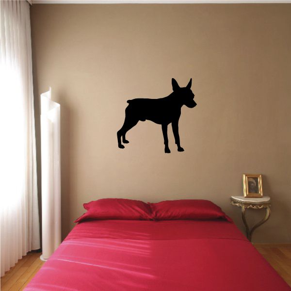 Miniature Pinscher dog decal, black silhouette of standing dog on wall.