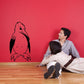 Mischievous penguin wall decal with black outline and pink interior