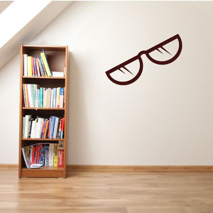 Reading glasses wall decal with dark brown outline and lens shapes