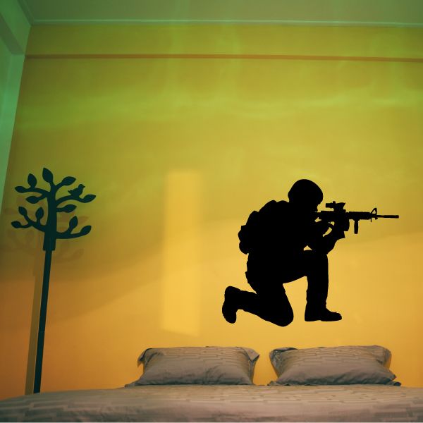 Kneeling soldier with rifle wall decal in dark silhouette