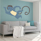 Smiling monkey sticker on wall, blue monkey with curling tail line art