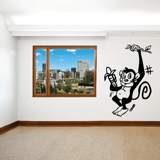 Image of Monkey with Banana Hanging on Branch Decal