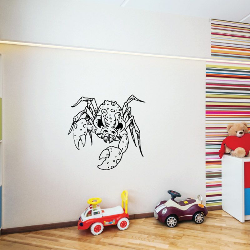 Monster crab decal with black line-art creature on white surface.