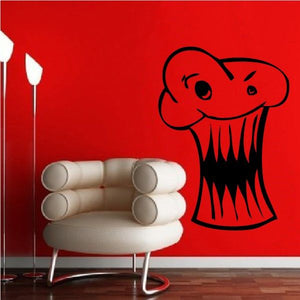 Monster cupcake decal with cartoon face and sharp teeth in black outline