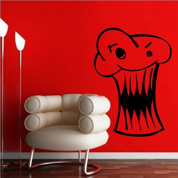 Monster cupcake decal with cartoon face and sharp teeth in black outline