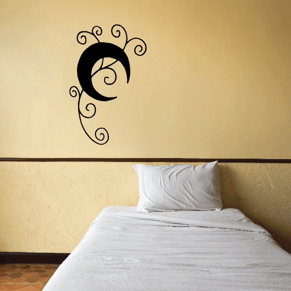Black moon wall decal with decorative swirls, crescent with spiral center.