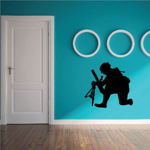 Mortar soldier firing wall decal with white target circles, black silhouette