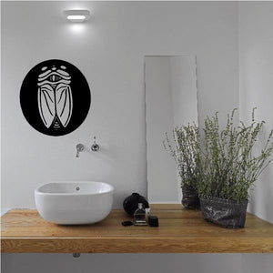Closed-wing moth wall decal: black circle with white outlined moth