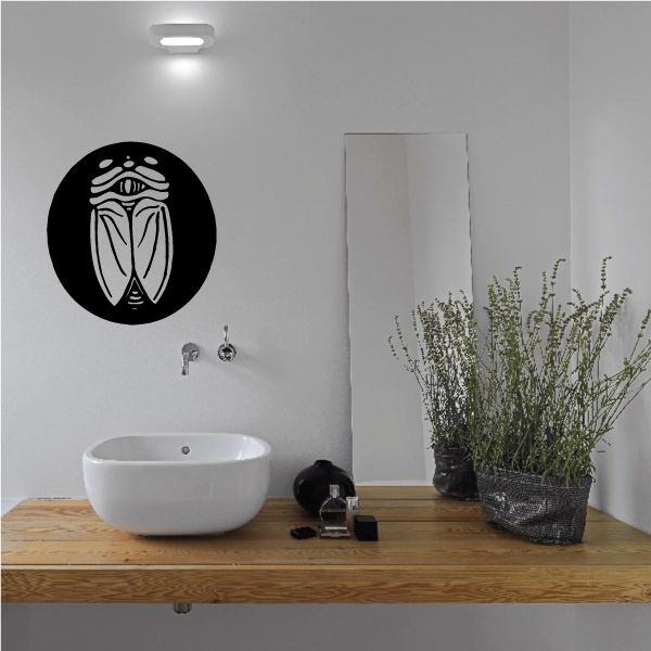 Closed-wing moth wall decal: black circle with white outlined moth