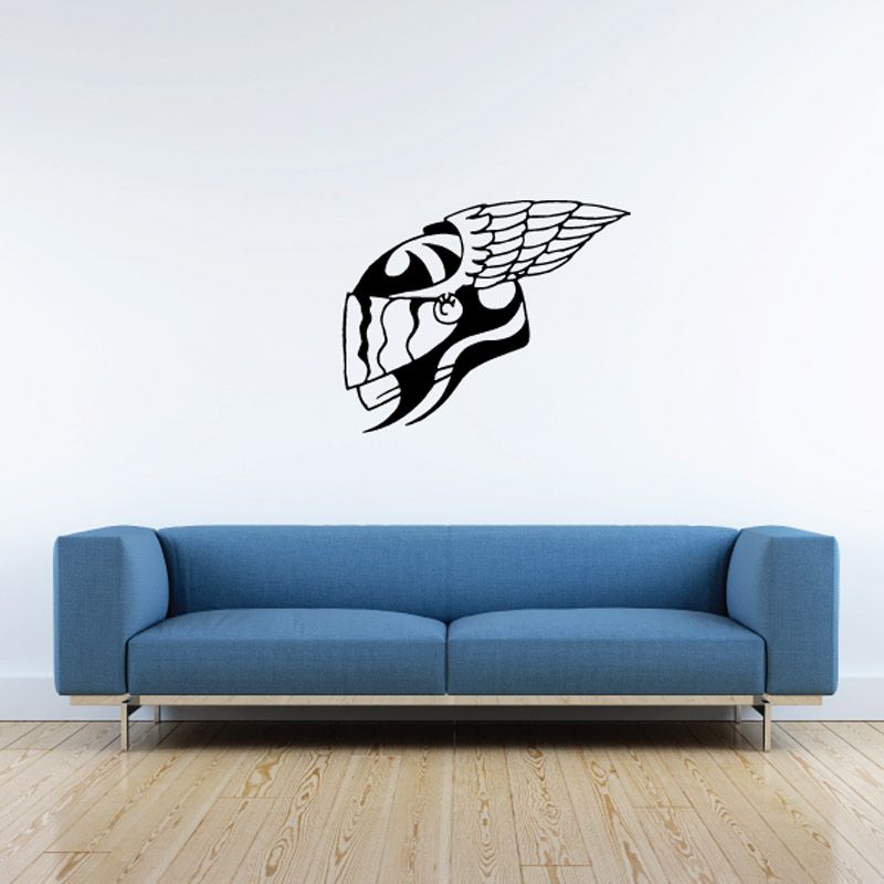 Motorcycle helmet decal with white wing graphic on dark background