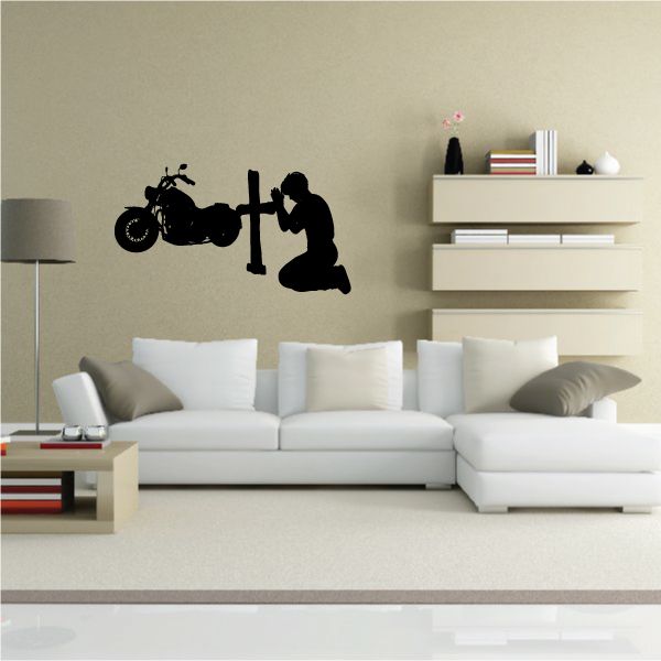 Motorcycle kneeling prayer decal with black silhouette of a rider and bike