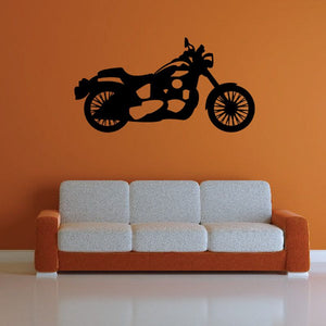 Motorcycle wall decal in black with racing bike silhouette above sofa