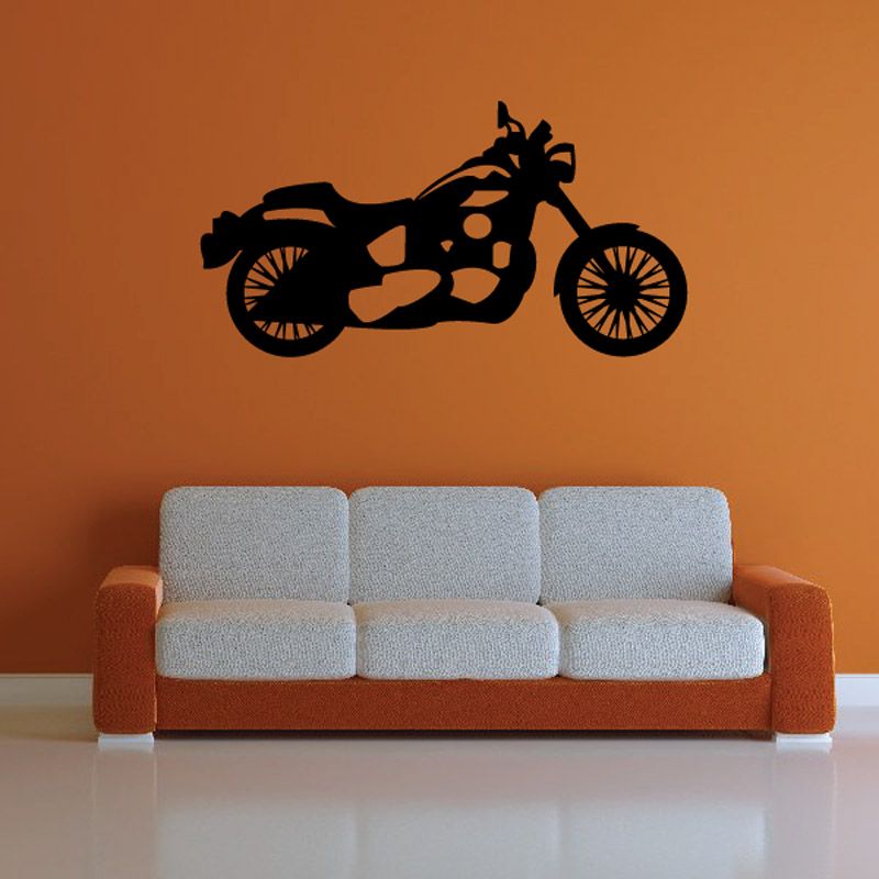 Motorcycle wall decal in black with racing bike silhouette above sofa