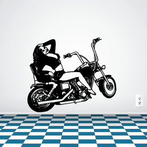 Motorcycle vinyl wall decal of a black bike with rider helmet on white