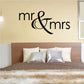 Wedding lettering decal with black “Mr & Mrs” script on wall