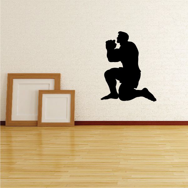 Black kneeling muscle man praying decal, one knee down and hands together.