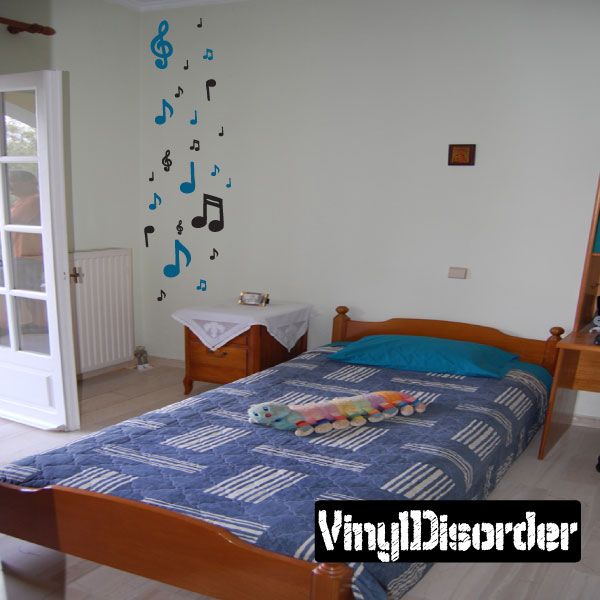 Music note wall decal kit with multicolor musical symbols on white wall