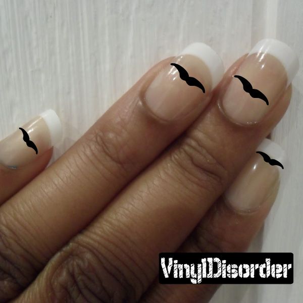Mustache nail art vinyl decals on fingers, black mustache tips over natural nails