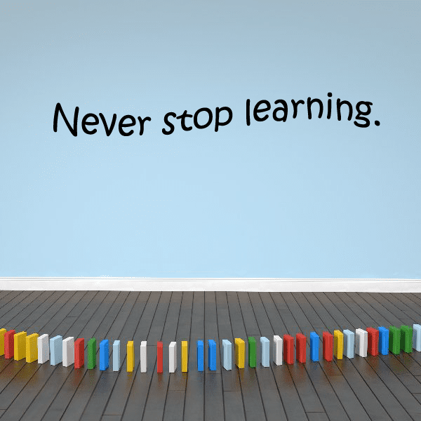 Wall decal with handwritten-style text: Never stop learning.