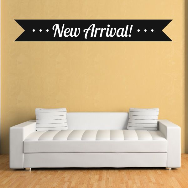Vinyl wall decal ribbon reading "New Arrival!" with decorative dots, black and white