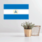 Nicaragua flag sticker, rectangular blue-white-blue design with coat of arms center.