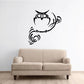 Black night owl wall decal on wispy branch, with decorative squiggles