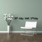 Wall decal with black text reading 'no day but today'.