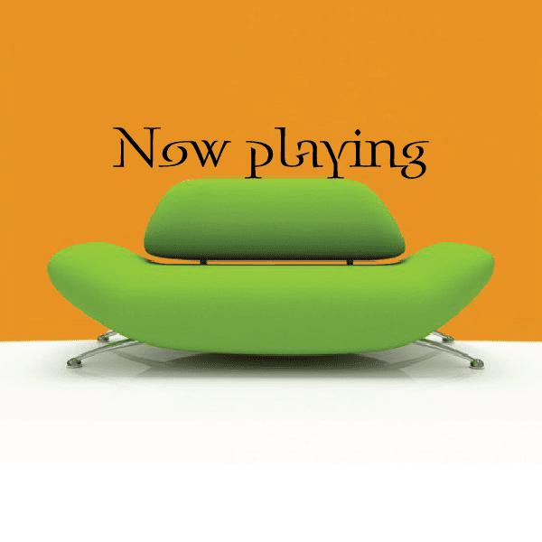 Now playing decal with stylized black text over green hat graphic