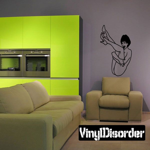 Black pinup-style wall decal of a nude woman in line-art pose