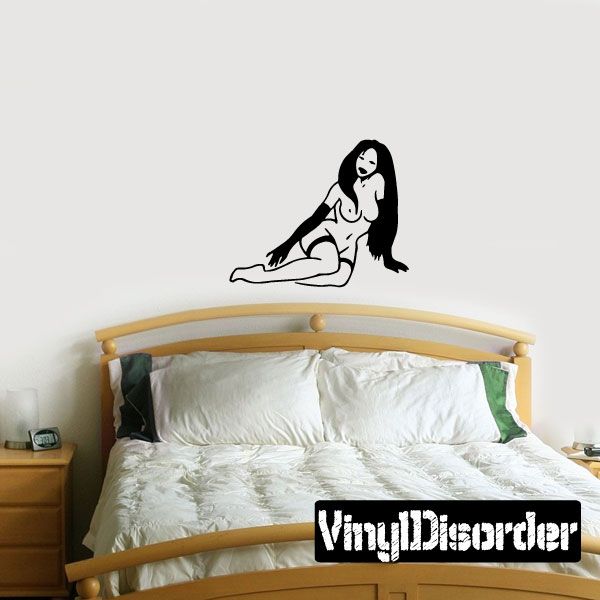 Black-and-white woman fixing stockings wall decal, kneeling