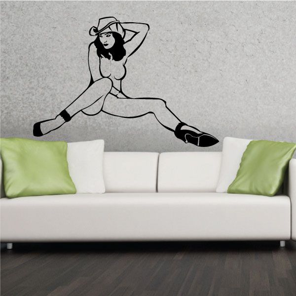 Black line art wall decal of nude woman in cowboy hat and heels, sitting pose.