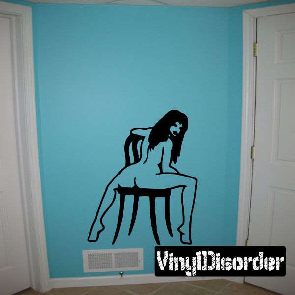 Nude woman sitting backwards on chair wall decal