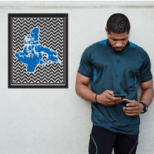 Chevron sticker with blue Nunavut map on black-and-white patterned background