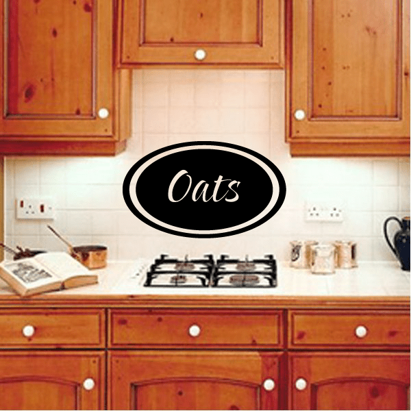 Black oval wall decal with cursive text “Oats” inside a white double border